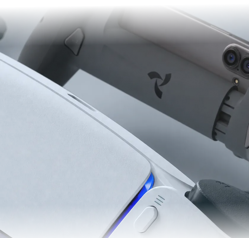 La manette Osyn Pro devant une console PS5.